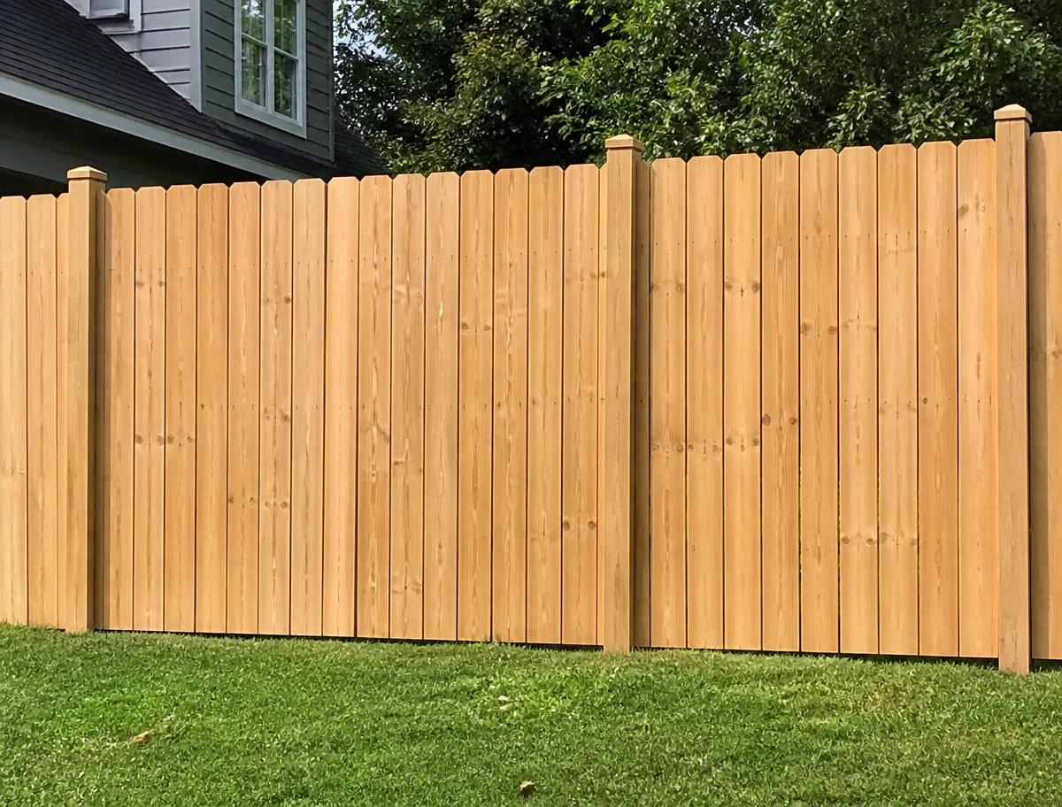 After — Wood fence power washing before and after in Pearl City, IL